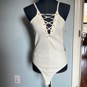 Express cream thong body suit size medium
